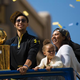 Stephen Curry of the Golden State Warriors; his elder daughter, Riley; and his wife, Ayesha, smile during a victory parade in Oakland, Calif., June 19, 2015, celebrating the Warriors’ first NBA title in 40 years.
Stephen Lam/Getty Images